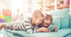 Two children using a tablet together