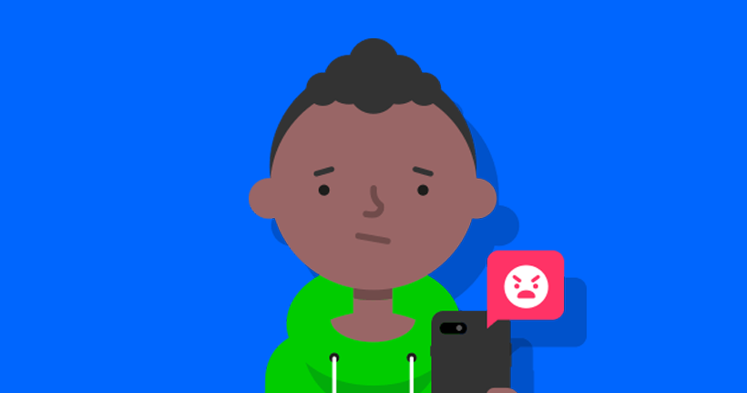 A boy with a smartphone frowns.