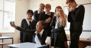 children in classroom taking a selfie