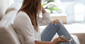 teenage girl holding a phone